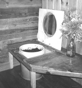 [open sawdust toilet]
